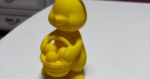 Easter bunny holding egg basket decoration