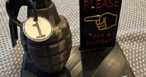 Grenade Complaint Department Take A Number Sign Plaque