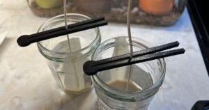 Candle wick clip